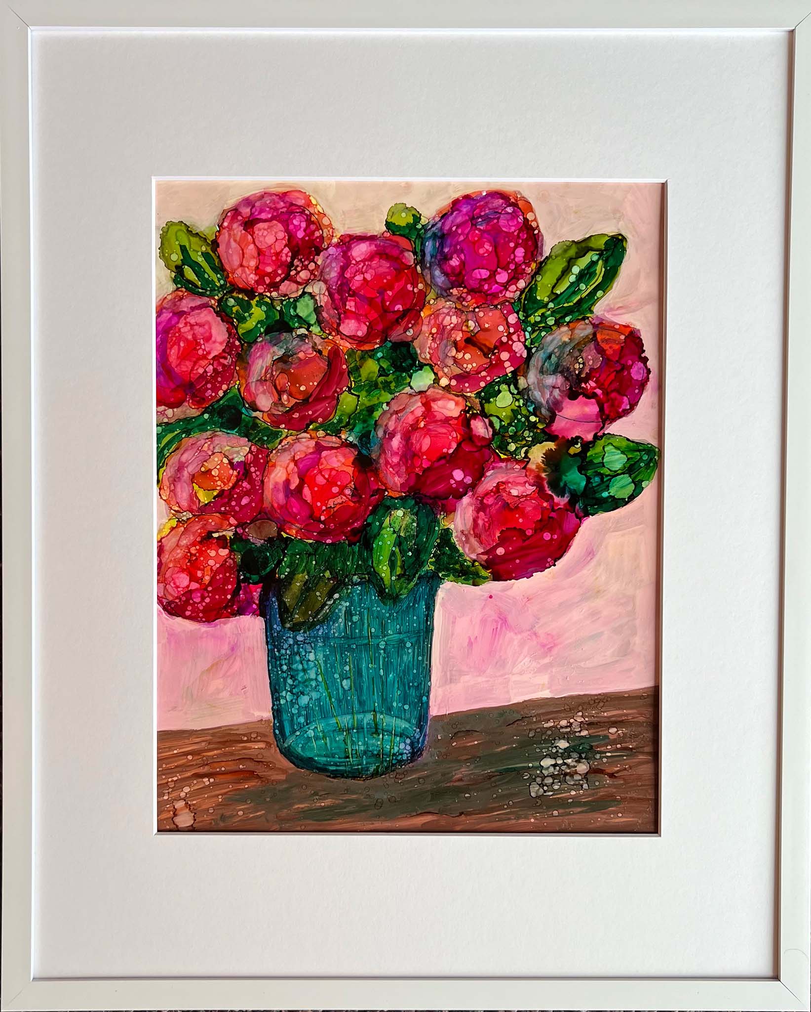 alchohol ink floral painting of pink and red flowers in a blue vase