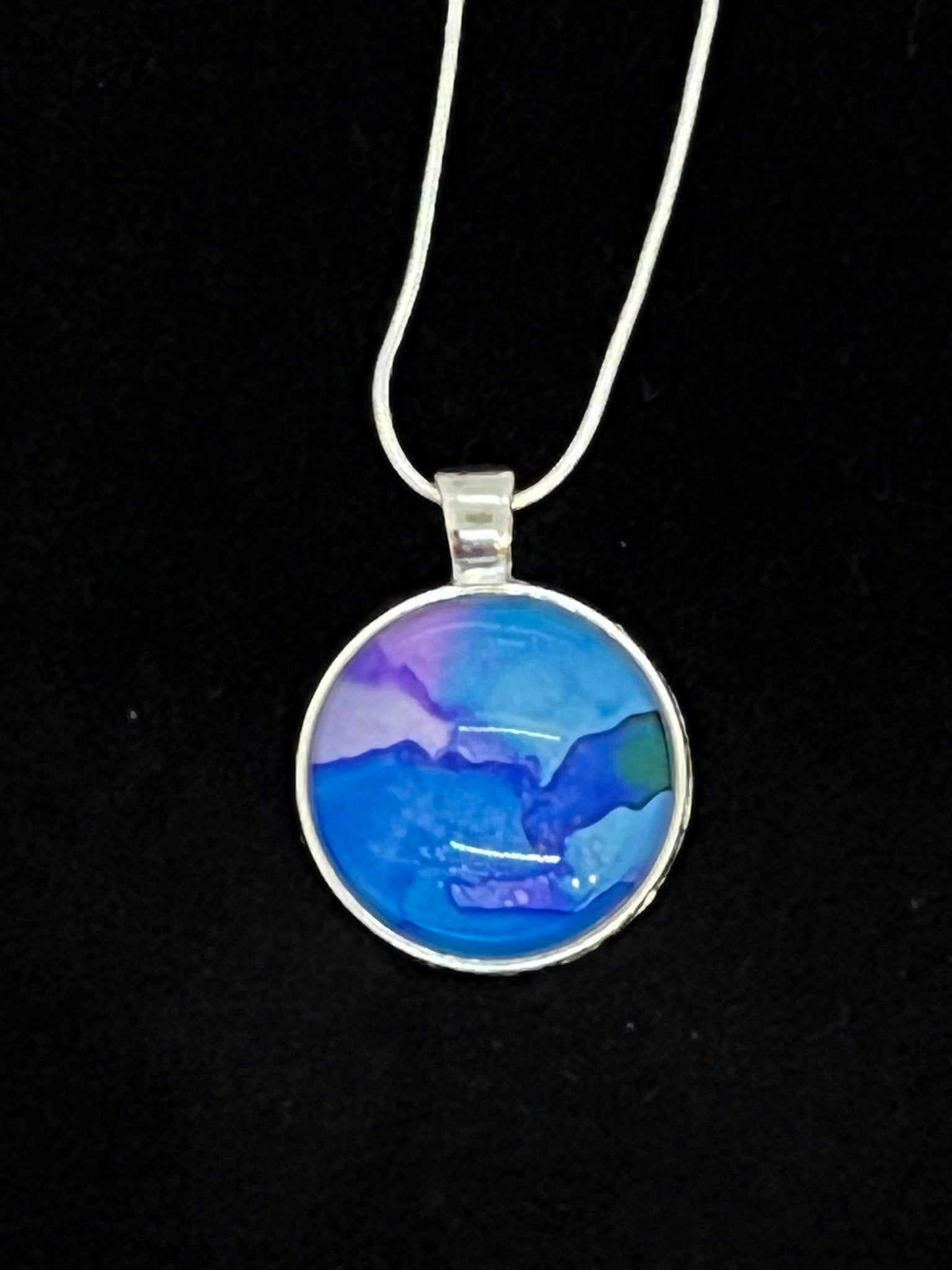 round cabachone dome silver pendant necklace with blue and purple artwork