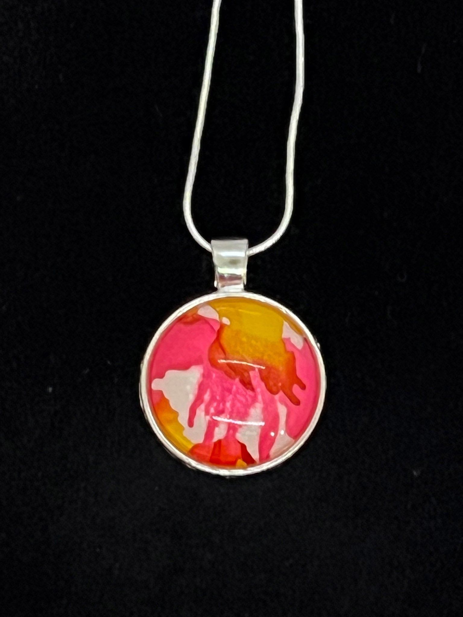 round cabachone dome silver pendant necklace with pink, yellow and white artwork